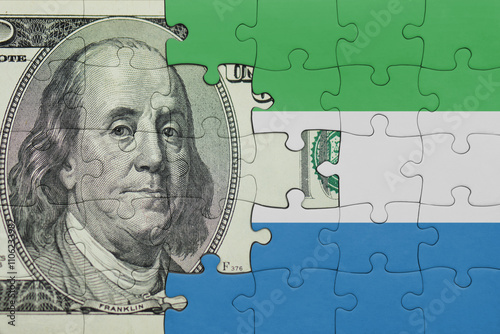 Wallpaper Mural puzzle with the national flag of sierra leone and the usa dollar money .finance concept Torontodigital.ca