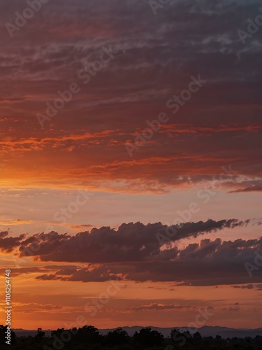 Horizon at sunset with hues of orange and pink.