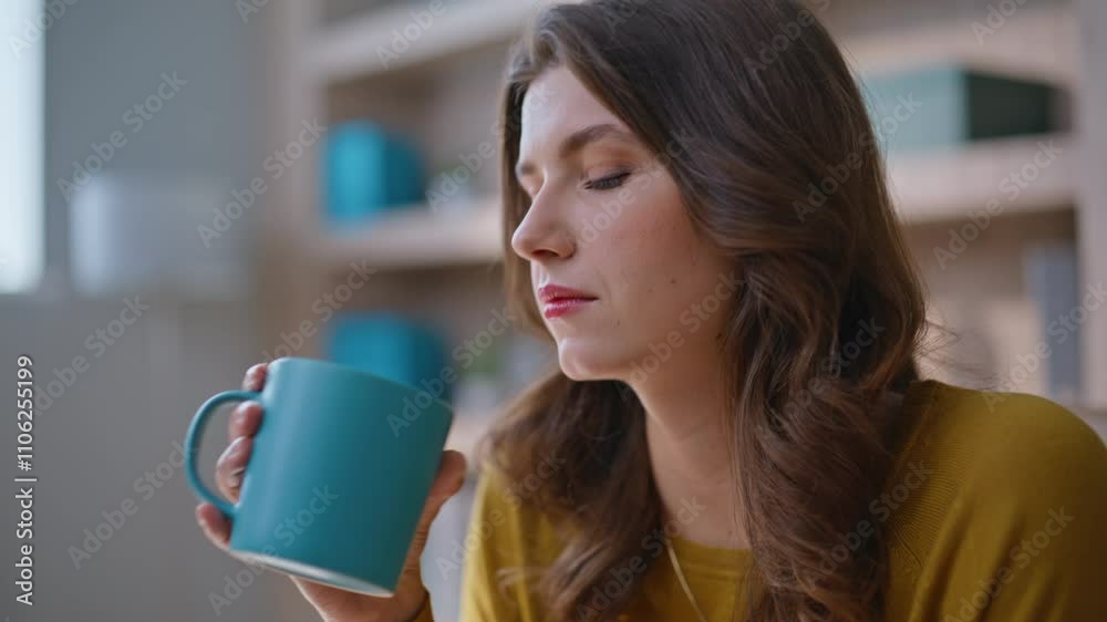 Thoughtful woman drinking coffee at modern home interior closeup portrait Thoughtful woman drinking coffee at modern home interior closeup portrait