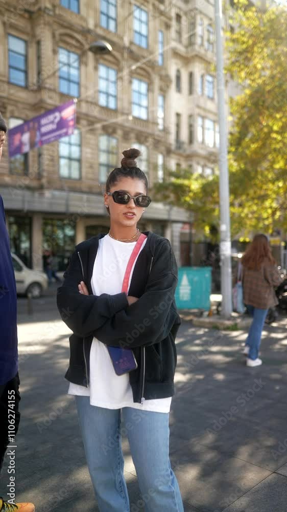 Urban Fashion A Stylish Individual Posing With Confidence in a Lively and Vibrant City Setting Urban Fashion A Stylish Individual Posing With Confidence in a Lively and Vibrant City Setting