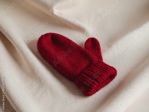 Cozy Red Knitted Mittens on Neutral Background for Winter Warmth. photo