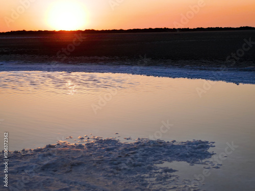 Bitter-salty internal-flow system through mud salty marches. Salt deposition in summer. The snowy whiteness of native salt at sunset on a hot day, glimmer. Sal glauberi, Berthollet salt photo