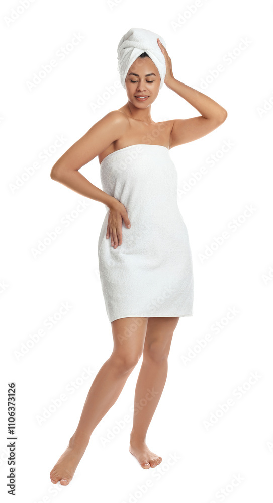 Beautiful young woman with towels on white background