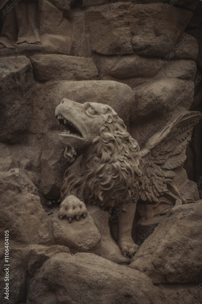 a finely crafted stone sculpture of a mythical creature resembling a lion with wings, perched on a rocky surface, showcasing intricate details in fur and feathers a finely crafted stone sculpture of a mythical creature resembling a lion with wings, perched on a rocky surface, showcasing intricate details in fur and feathers