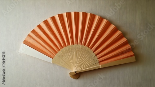 Beautiful hand fan made of wood and paper, useful for cooling down on a hot summer day photo