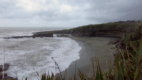 Waves crashing on a beach in new zealand