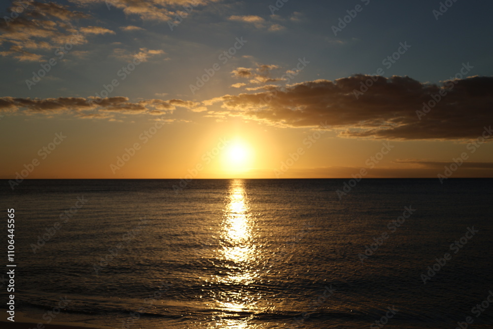 sunset over the ocean blue sky at evening sunset over the ocean blue sky at evening