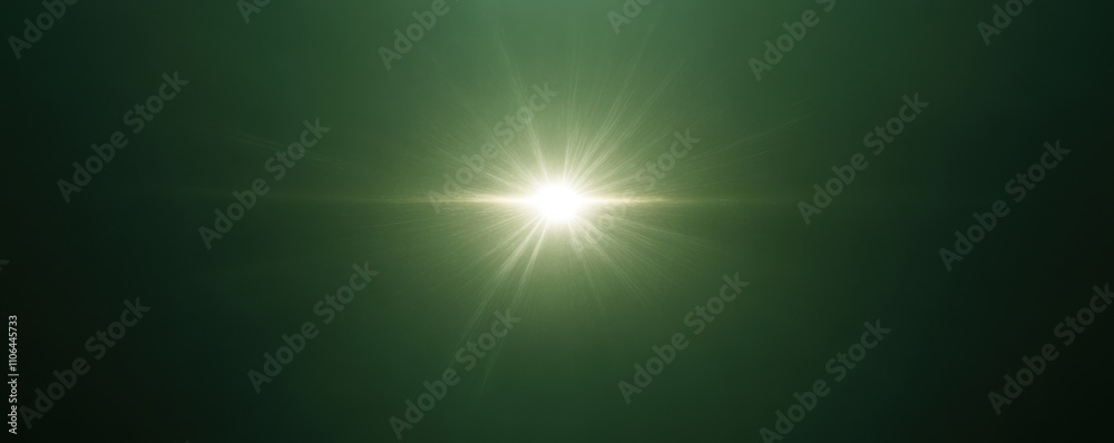 Obraz premium Bright starburst light effect with radiant beams on a dark green background