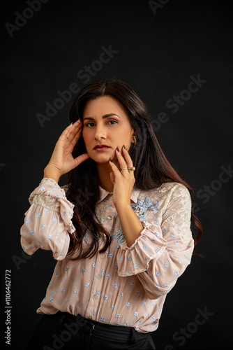 Portrait of a woman in a floral blouse.