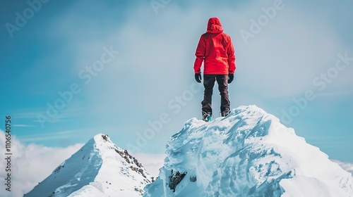 Standing atop a snow-capped peak is a hiker wearing a red jacket, Generative AI. photo