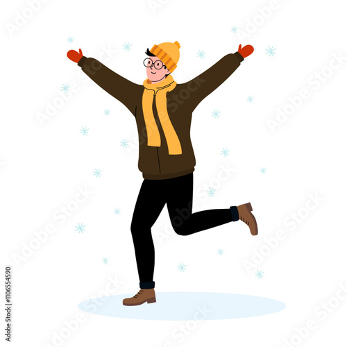 Person joyfully playing in falling snow during winter season with warm clothing