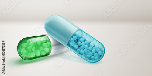 Translucent green and blue capsules with soft shadows, filled with smal medicine granules inside, lying on a white surface