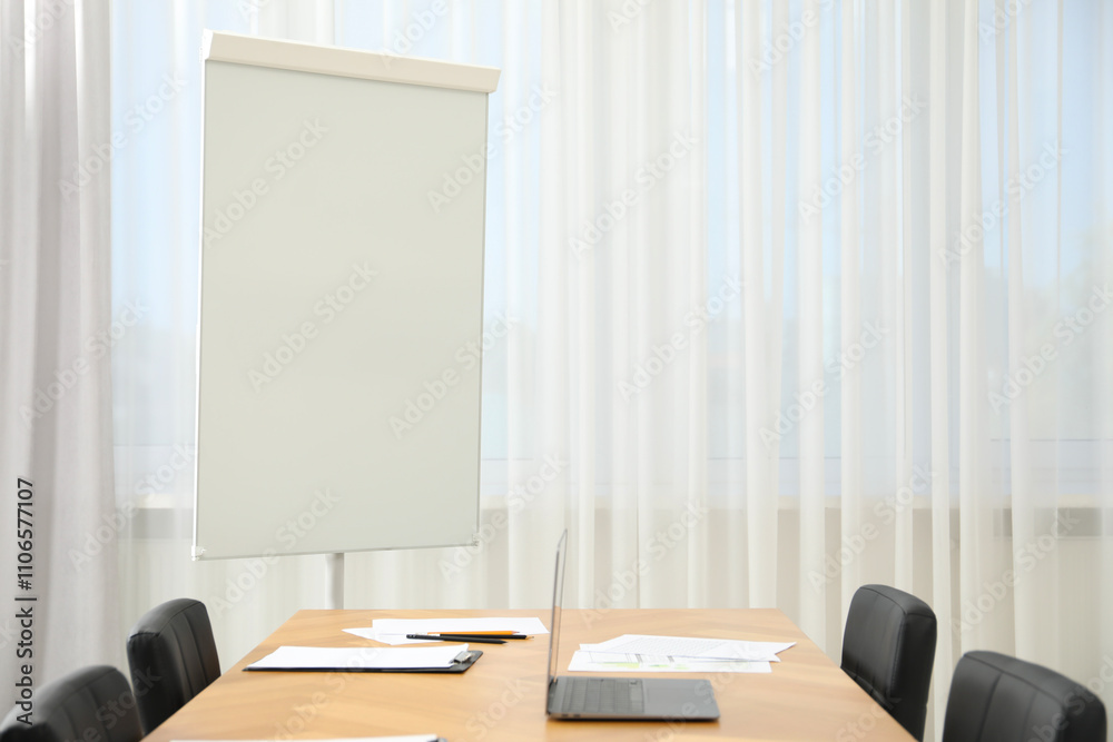 Flip chart, wooden table and chairs in conference room. Mockup for design Flip chart, wooden table and chairs in conference room. Mockup for design