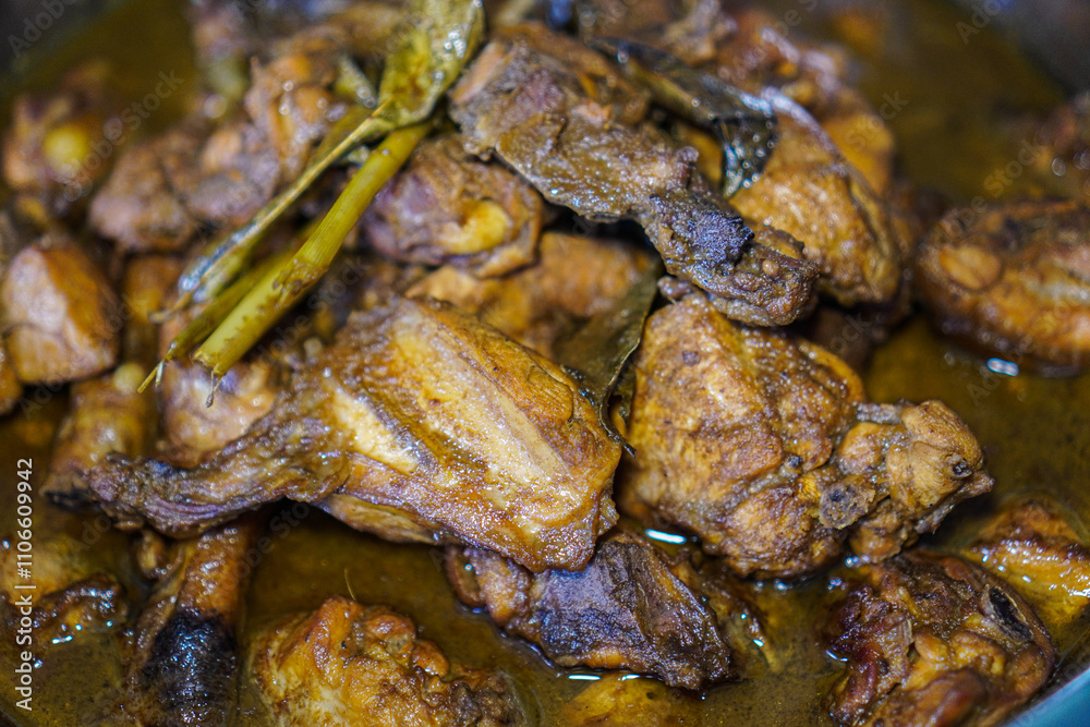 Close-up of succulent braised chicken pieces in a rich, dark brown sauce. A delectable culinary delight. Delicious Braised Chicken in Rich Brown Sauce. Close-up of succulent braised chicken pieces in a rich, dark brown sauce. A delectable culinary delight. Delicious Braised Chicken in Rich Brown Sauce.