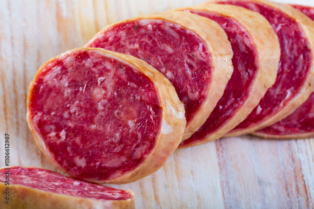 Close up of traditional Spanish dried pork sausage Salchichon Close up of traditional Spanish dried pork sausage Salchichon