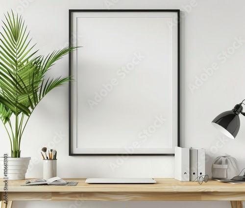 A blank poster frame on a white wall above a wooden desk with office supplies and a plant