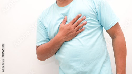 Men have chest pain caused by heart disease, heart attack, heart leakage, coronary heart disease. photo