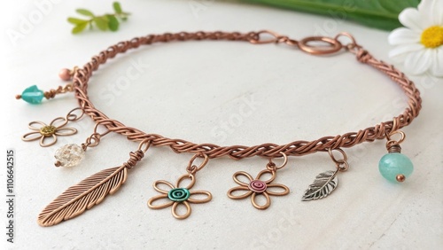 Bohemianstyle anklet created from repurposed copper wire embellished with small handcrafted charms and artificial gemstones. photo