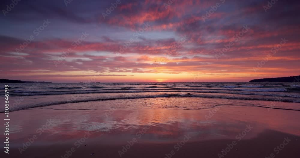 Tropical beach shore and beautiful sunrise over the sea horizon and calm ripple waves