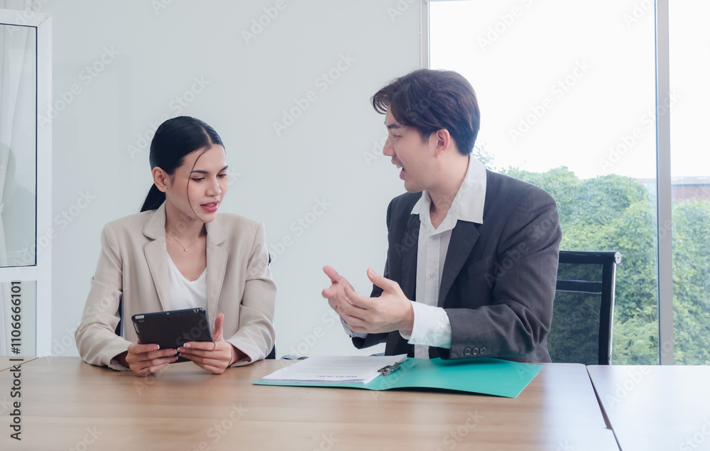 Business team woman and man asian group meeting sitting on desk looking talk think creative idea computer on table ready happy working new project job online product sale marketing in office company. Business team woman and man asian group meeting sitting on desk looking talk think creative idea computer on table ready happy working new project job online product sale marketing in office company.