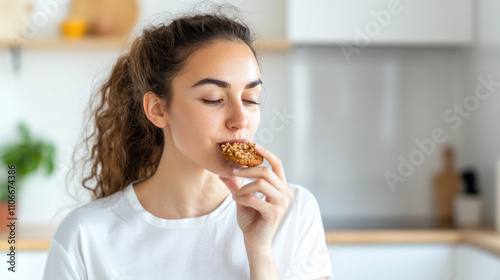 Australian woman grabbing eating cookies at kitchen, enjoy family tradition