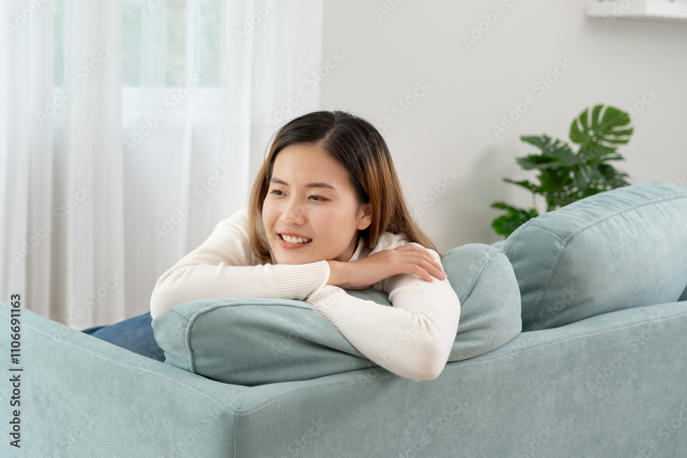 Joyful young Asian women sitting on sofa and enjoy life on holiday, having fun, listening to music, raising his arm, dancing to favorite song, enjoying cool soundtrack, happy life, recreation Joyful young Asian women sitting on sofa and enjoy life on holiday, having fun, listening to music, raising his arm, dancing to favorite song, enjoying cool soundtrack, happy life, recreation