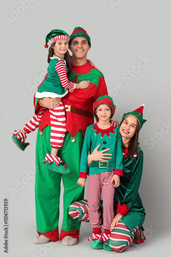 Happy family in elf's costu...