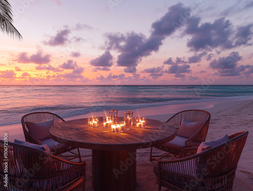 A serene beach setup with a round wooden table and elegant chairs, adorned with candles. The scene is completed by a soft, colorful sunset and gentle ocean breeze photo