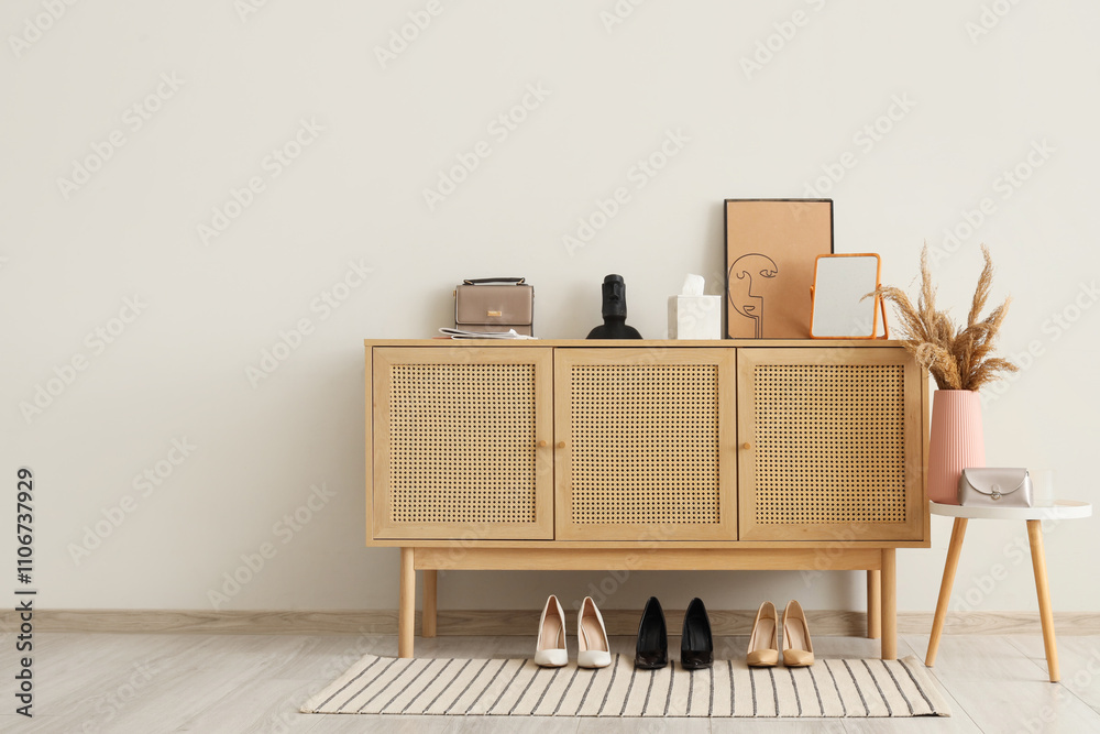 Obraz premium Interior of hallway with commode, table and shoes