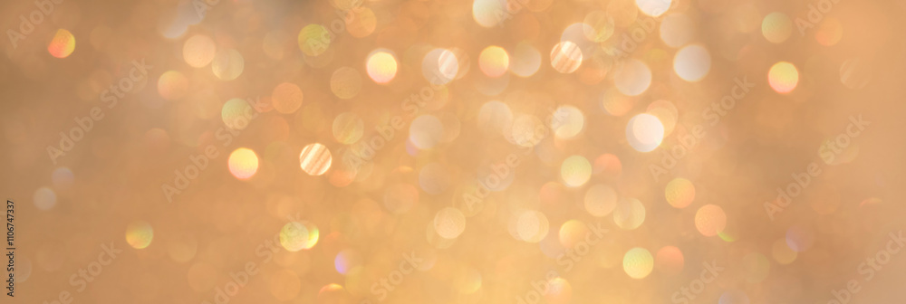 Blurred background golden glitter shiny sparkling banner. Happy Holidays background for template on christmas card brochures posters. Gold bokeh template for digital presentation slideshow background Blurred background golden glitter shiny sparkling banner. Happy Holidays background for template on christmas card brochures posters. Gold bokeh template for digital presentation slideshow background