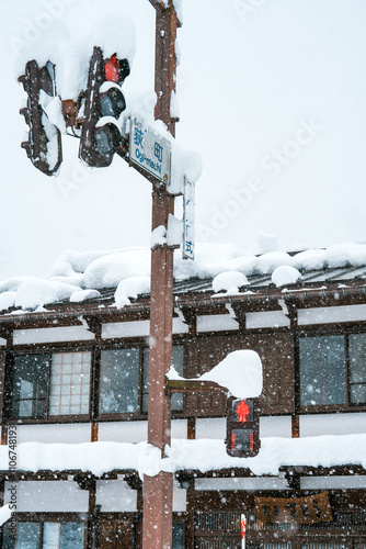 Snowy Town Street with Traffic Lights in Winter Weather