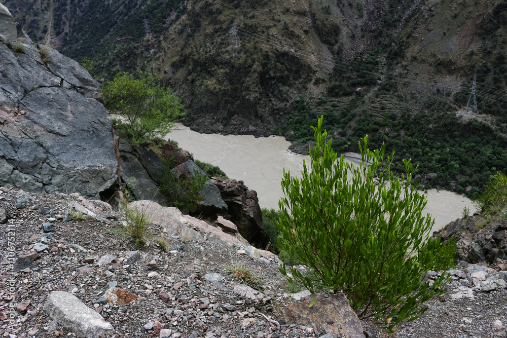 Rugged Terrain Overlooking a Serene River Rugged Terrain Overlooking a Serene River