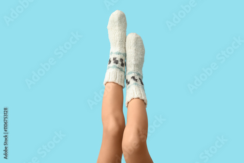 Cozy knitted socks on legs ...