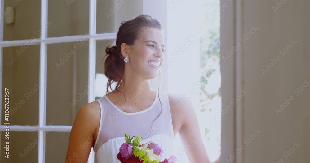 Smiling bride standing near the window with a bouquet 4K 4k Smiling bride standing near the window with a bouquet 4K 4k