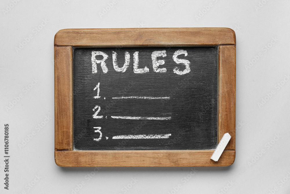 Chalkboard with blank list of rules on light background Chalkboard with blank list of rules on light background