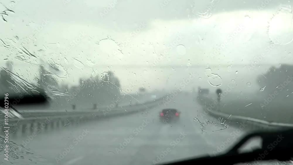 a downpour on the car window, the work of the wipers a downpour on the car window, the work of the wipers