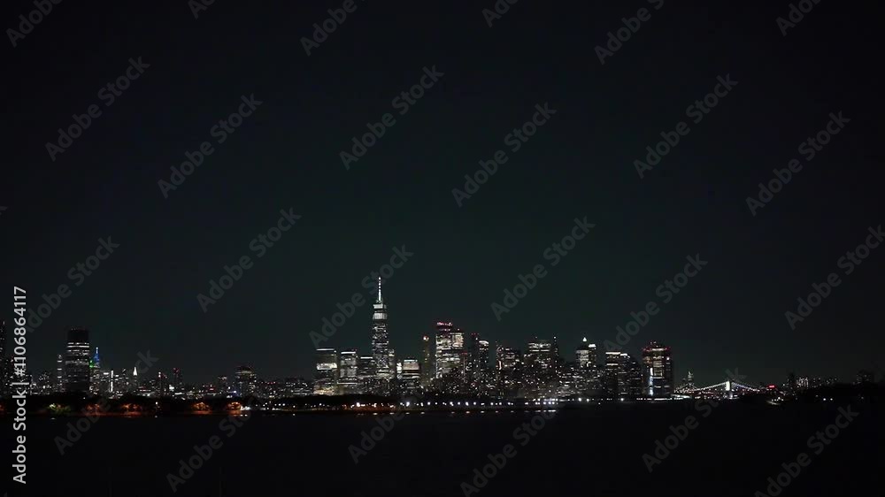Stunning night view of Manhattan skyline showcasing brightly lit skyscrapers and iconic structures under a clear night sky New York Stunning night view of Manhattan skyline showcasing brightly lit skyscrapers and iconic structures under a clear night sky New York
