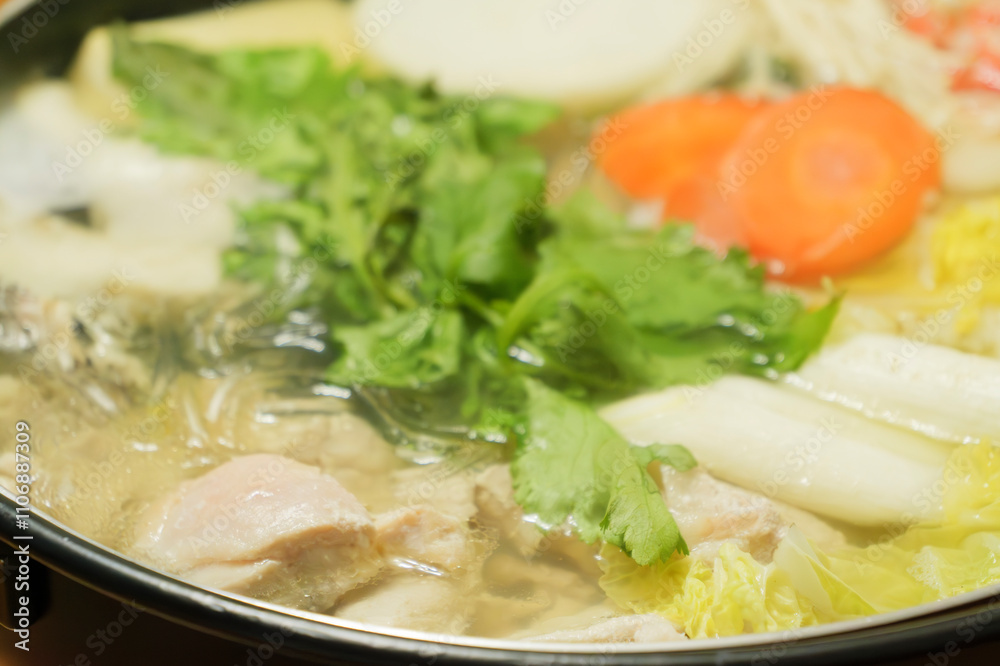 Mizutaki pot, a famous Japanese winter dish of stewed vegetables, meat, and seafood Mizutaki pot, a famous Japanese winter dish of stewed vegetables, meat, and seafood