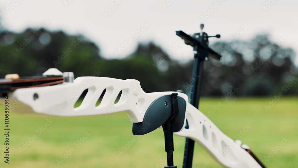 Archery, sports and closeup of bow in field for target practice, challenge and competition outdoors. Shooting range, crossbow and equipment for tournament, game and training for hobby in Japan Archery, sports and closeup of bow in field for target practice, challenge and competition outdoors. Shooting range, crossbow and equipment for tournament, game and training for hobby in Japan