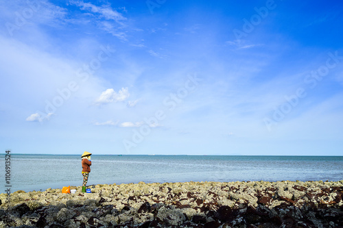 Coastal landscape with rock beach blocking the sea waves in Go Cong, Tien Giang province, Vietnam photo