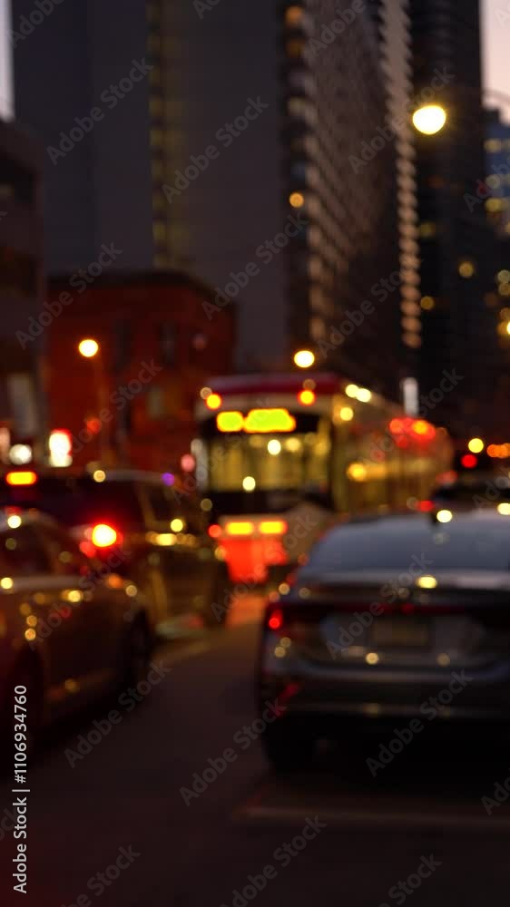 Blurred city lights and silhouettes in a vibrant night scene, with a cyclist passing by cars. A dreamy and dynamic urban view. Blurred city lights and silhouettes in a vibrant night scene, with a cyclist passing by cars. A dreamy and dynamic urban view.