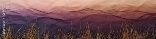 A close-up of textured paper resembling a sunset sky with wispy grass at the bottom, creating a serene atmosphere.