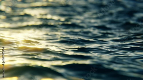 Close-up view of evening ocean waves in slow motion, seamless loop background
