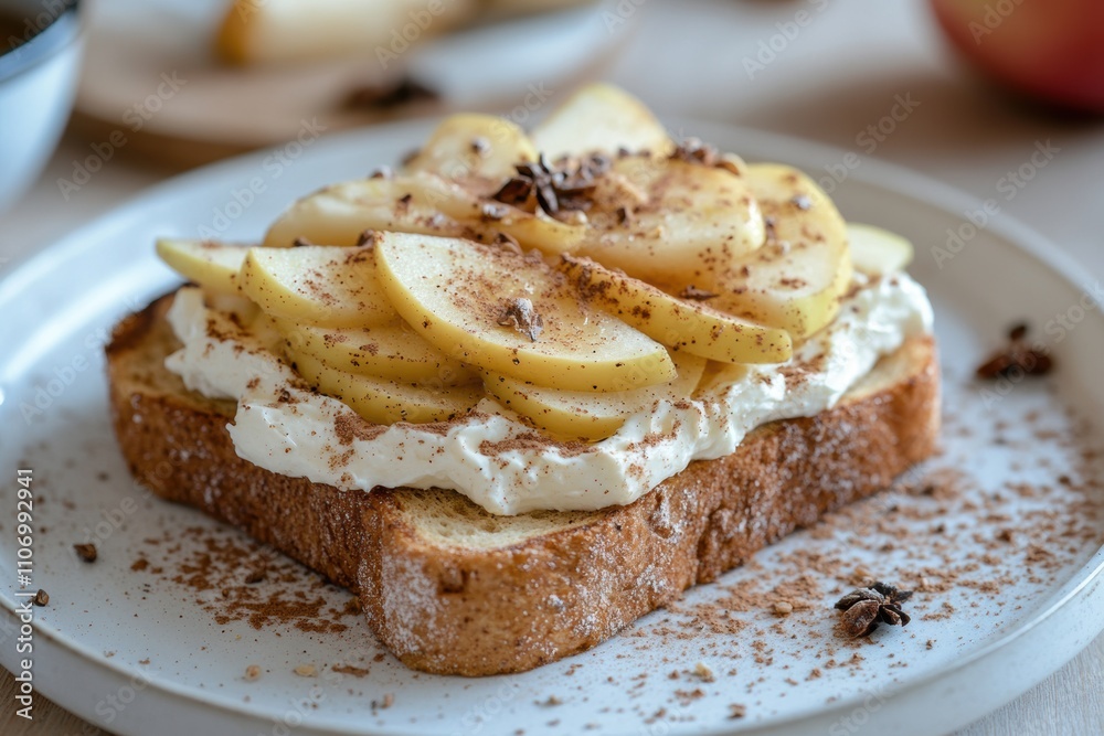 a breakfast concept apple slices on top of cream cheese spread over cinnamon toast placed on a white plate a breakfast concept apple slices on top of cream cheese spread over cinnamon toast placed on a white plate