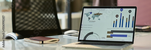 Fotografía Header of charts and diagram on screen of laptop standing on workplace of modern