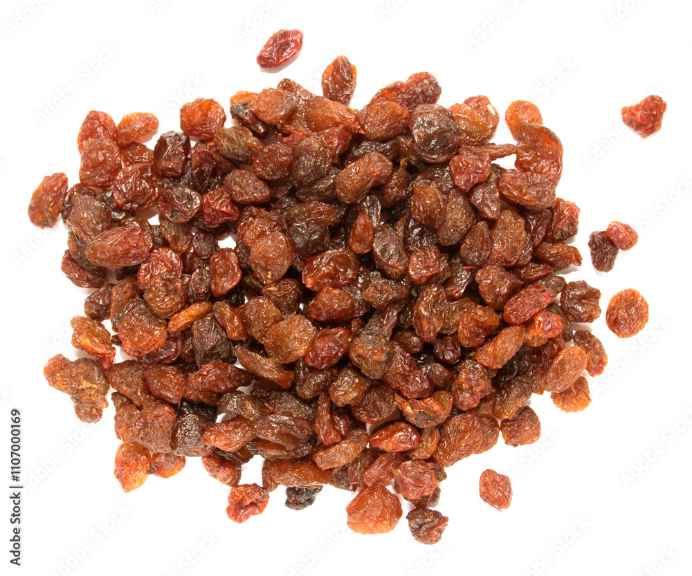 A pile of dried fruit, mostly raisins, on a white background A pile of dried fruit, mostly raisins, on a white background