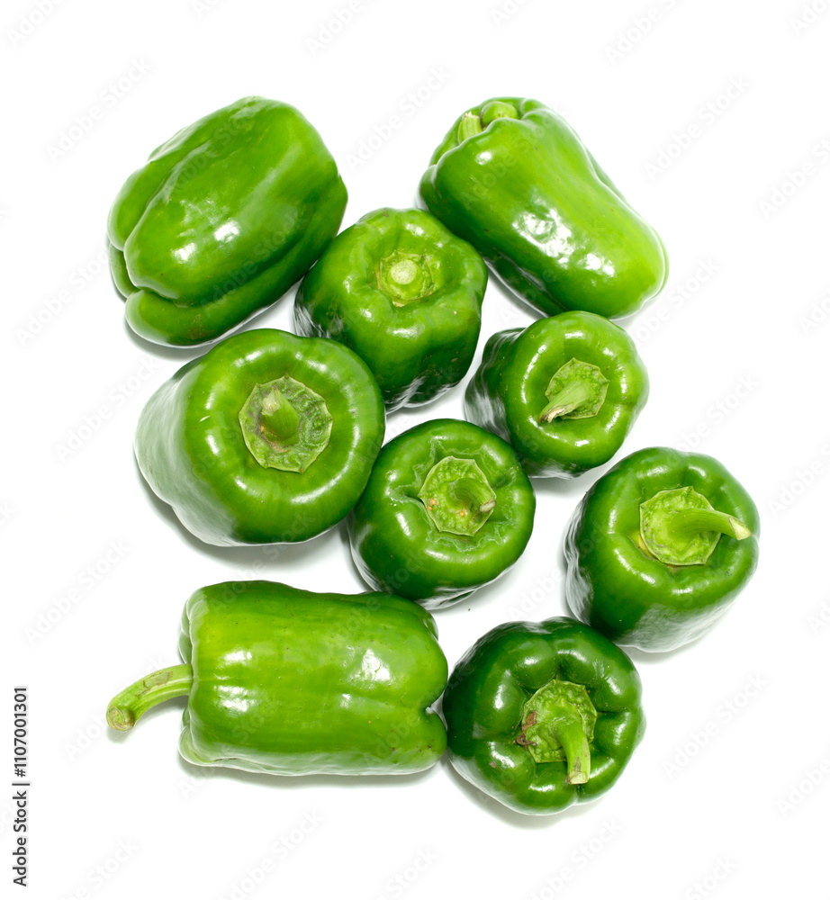 A bunch of green peppers are displayed on a white background A bunch of green peppers are displayed on a white background