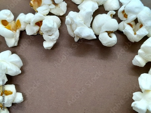 Popcorne close up with brown background. photo