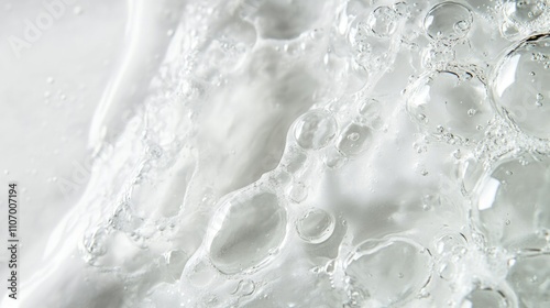 White background with a lot of bubbles in the water. The bubbles are scattered all over the water, creating a sense of movement and energy. The bubbles are of different sizes and shapes