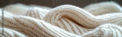 Close up of a white knitted blanket, white background